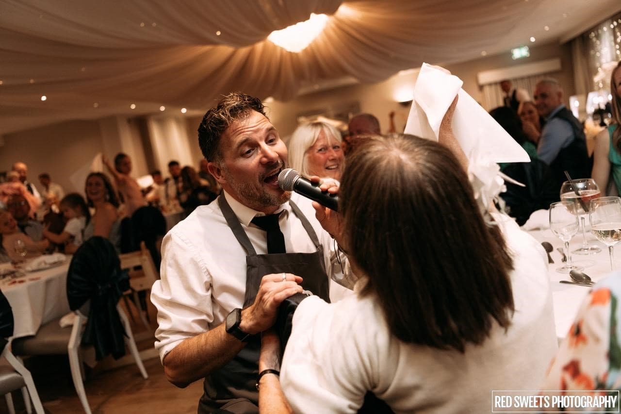 Wedding guests singing and dancing